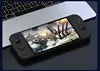 C G90 Portable Handheld 7 Video Game Console sur un bureau avec un ordinateur portable en arrière-plan.
